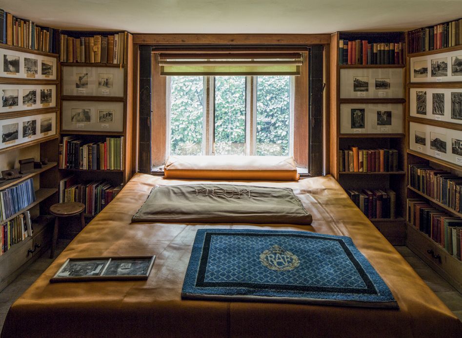 Image may contain Furniture Bookcase Shelf Interior Design Indoors Bed Wood and Room