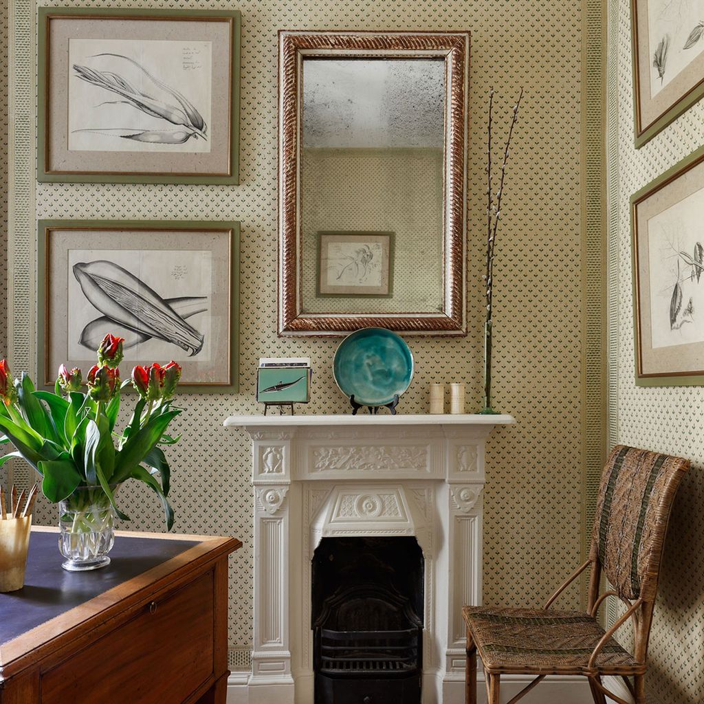 Image may contain Furniture Chair Indoors Fireplace Interior Design Plant Living Room Room Hearth and Home Decor