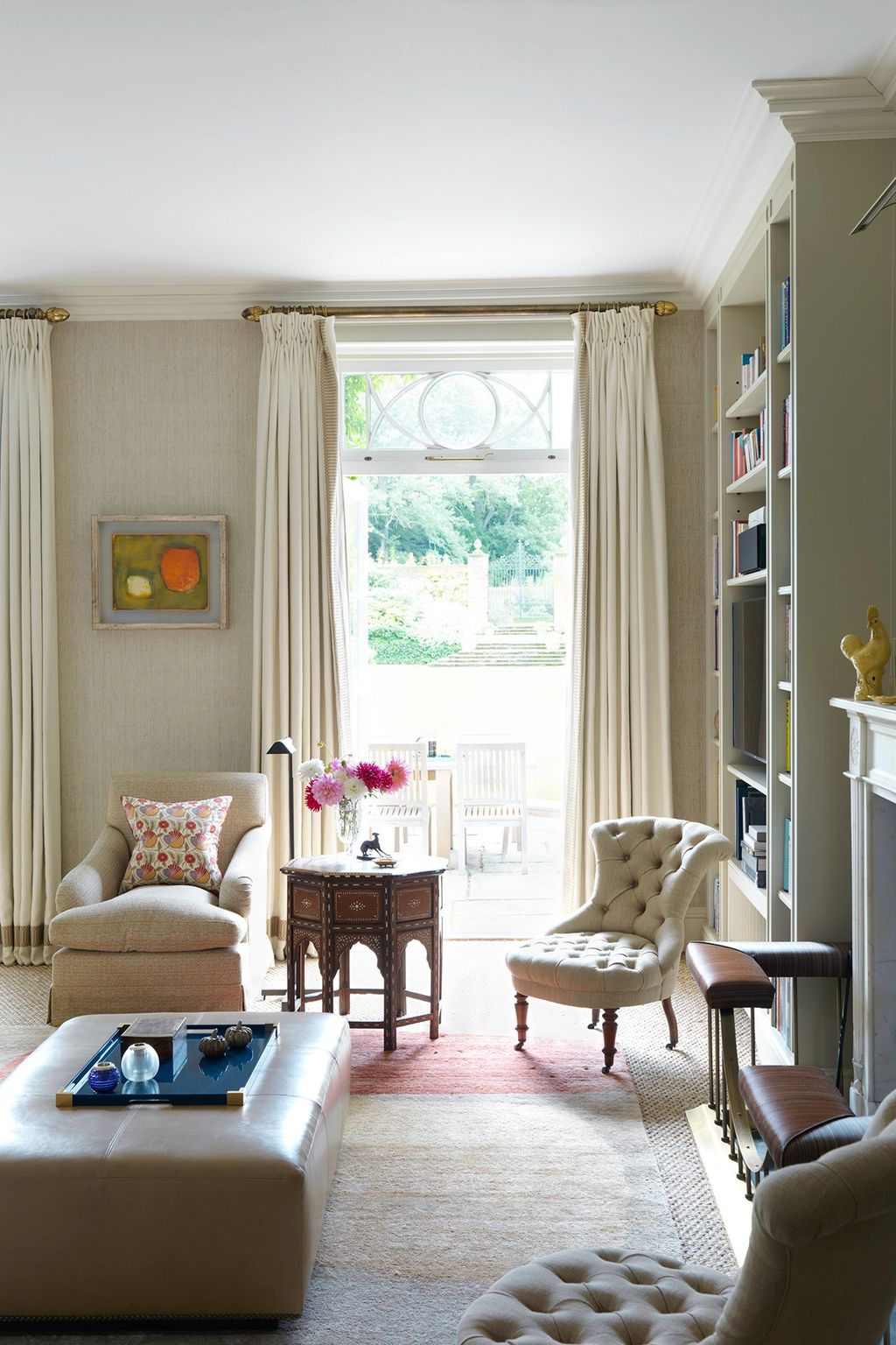 Image may contain Furniture Living Room Indoors Room Table Rug and Chair