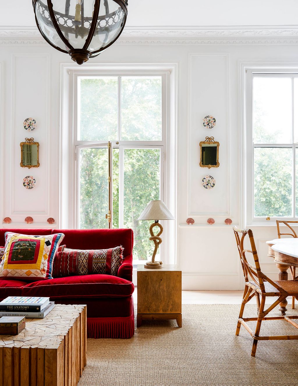 Image may contain Furniture Cushion Pillow Lamp Table Lamp Table Living Room Room Indoors and Chair