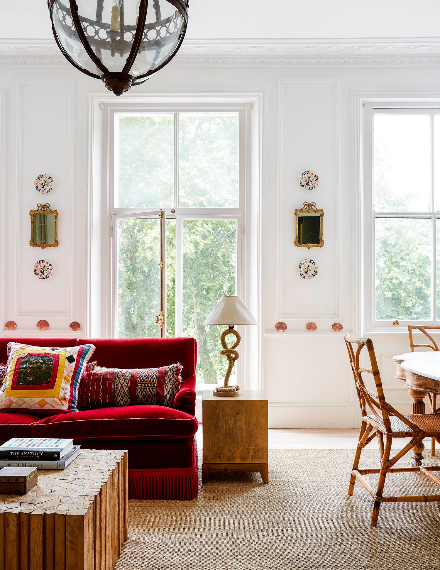 Image may contain Furniture Cushion Pillow Lamp Table Lamp Table Living Room Room Indoors and Chair