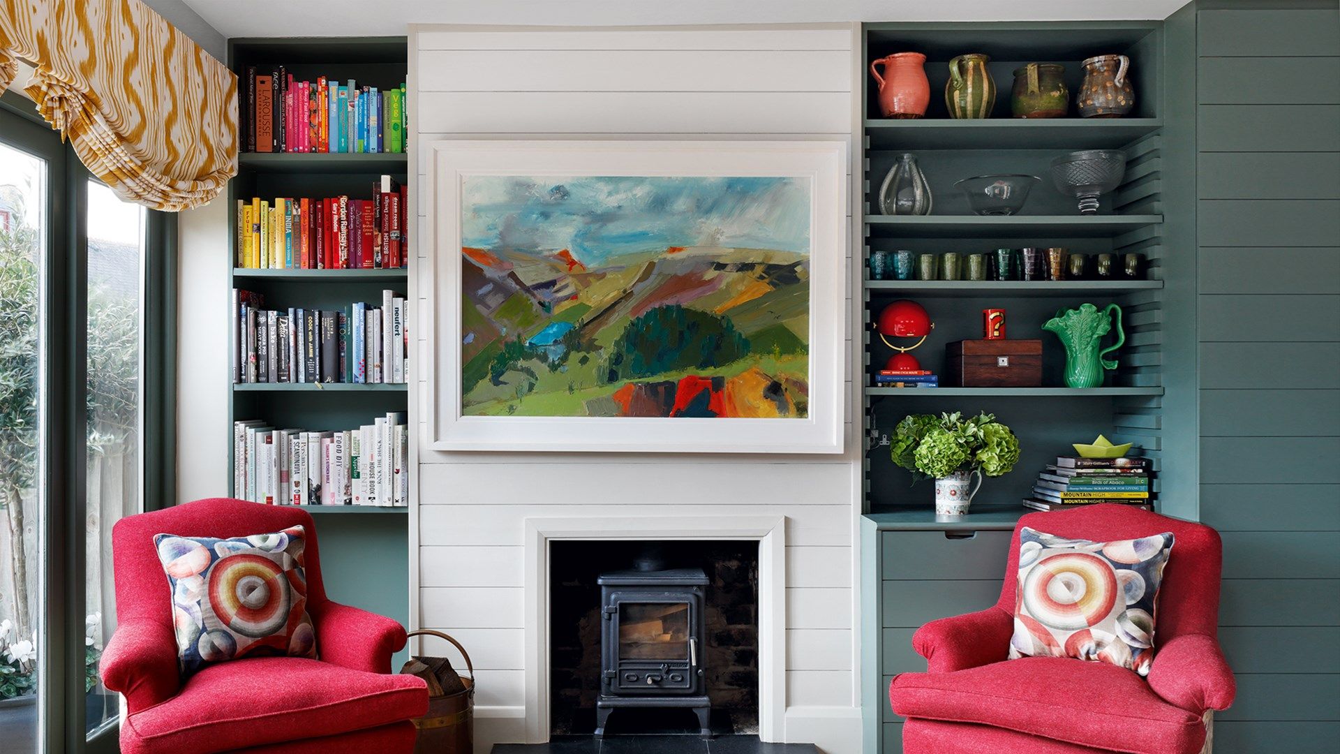 Image may contain Furniture Living Room Room Indoors Cushion Home Decor Interior Design Fireplace Hearth and Couch