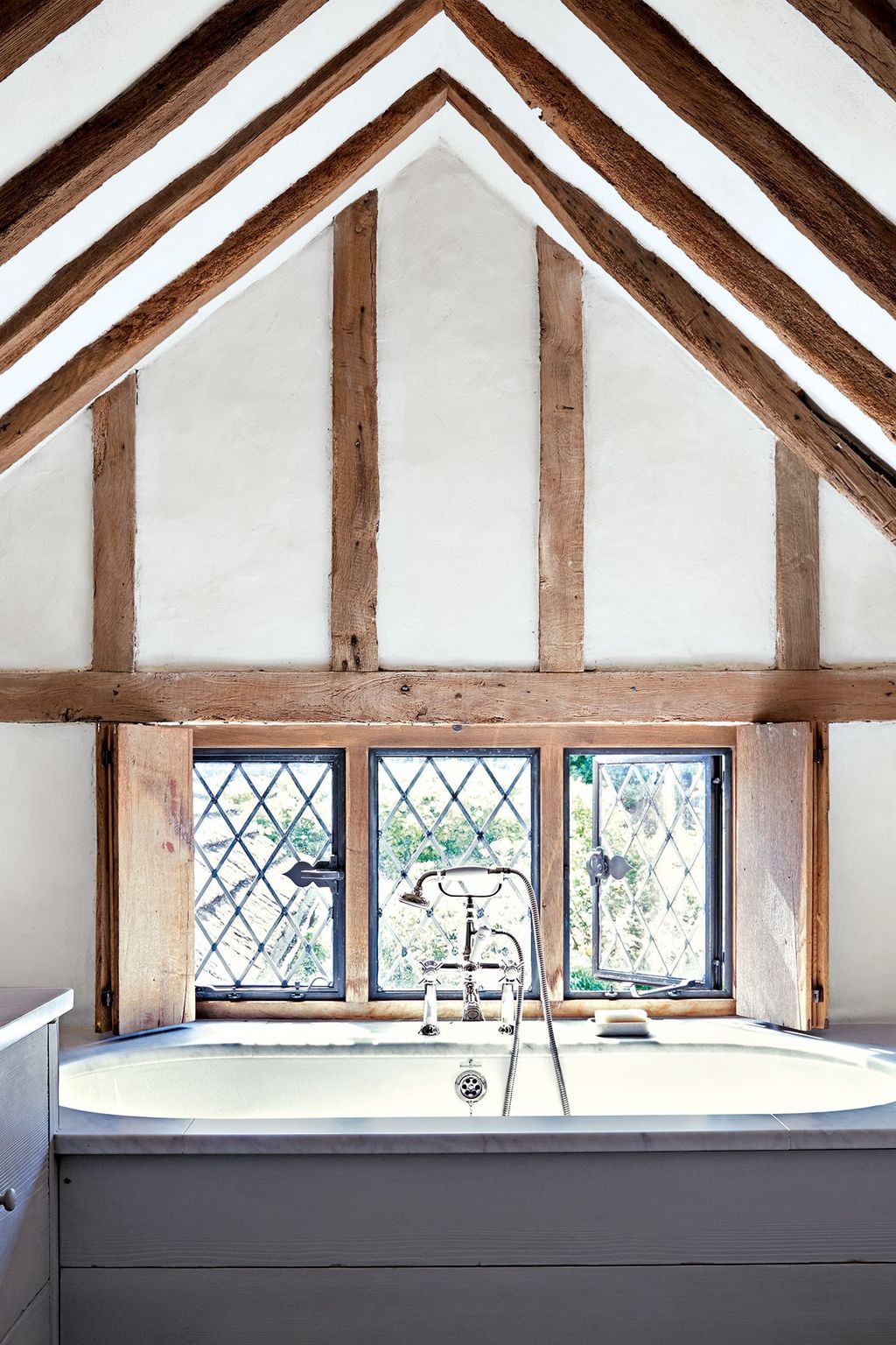 Image may contain Loft Housing Building Indoors Attic Bathtub Tub and Interior Design