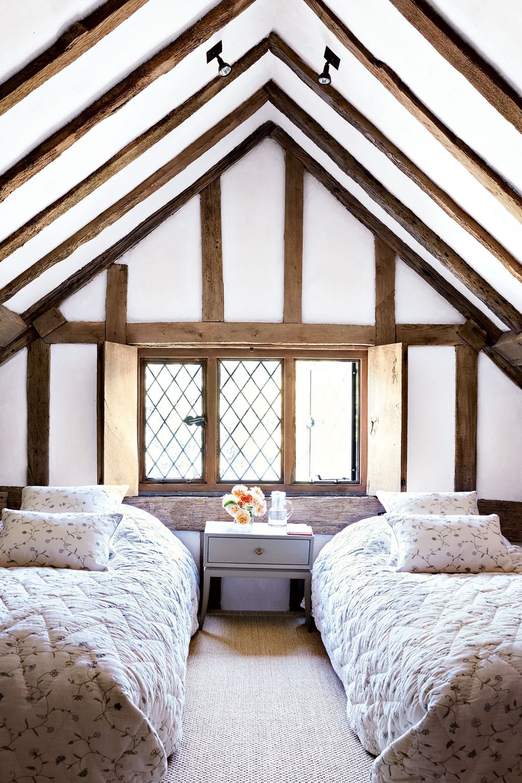 Image may contain Housing Building Room Bedroom Indoors Loft Attic Dorm Room Furniture and Bed