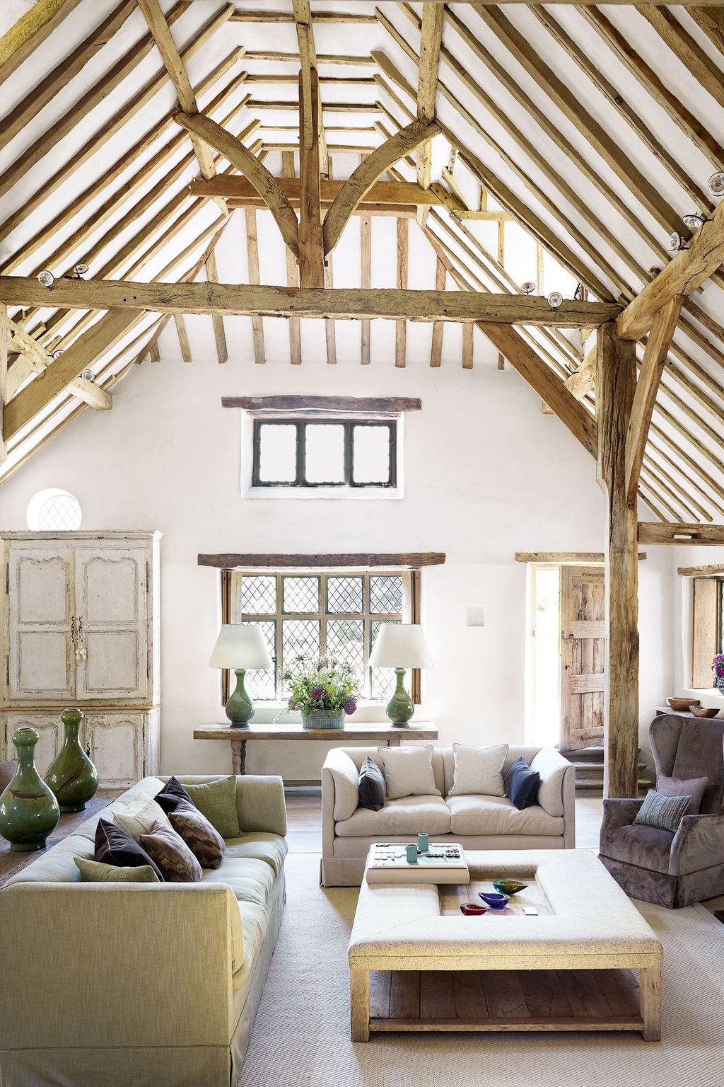 Image may contain Furniture Living Room Indoors Room Housing Building Table Loft Coffee Table and Interior Design