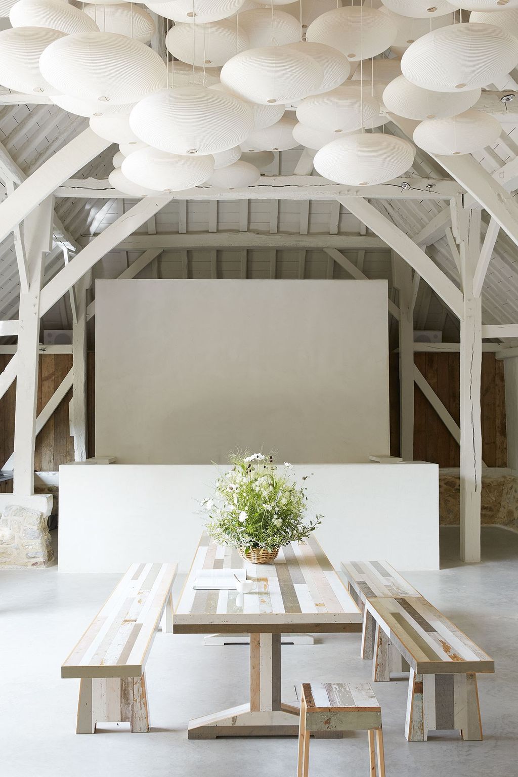 Image may contain Loft Housing Building Indoors Interior Design Flooring Attic Furniture Wood and Table