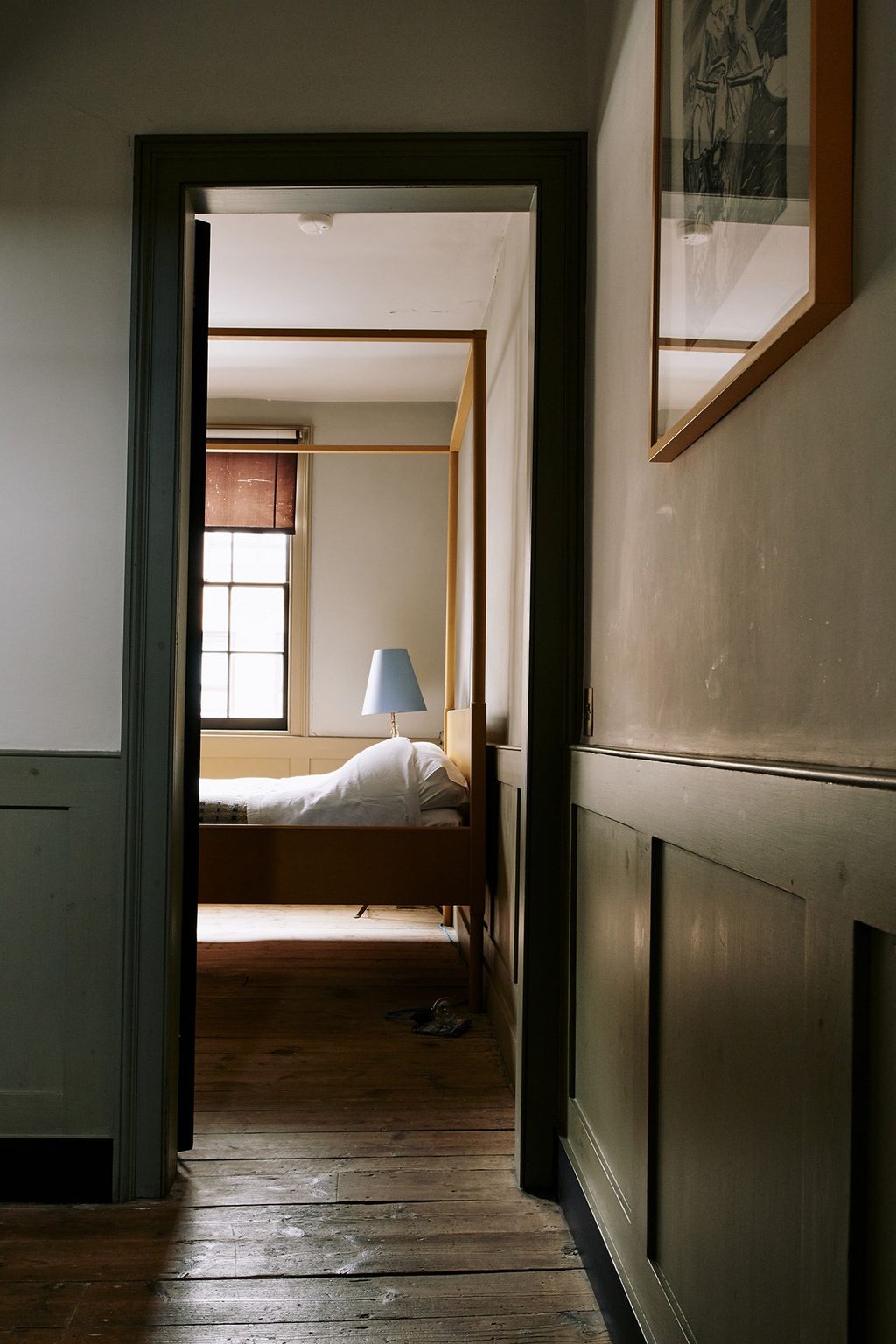 Image may contain Flooring Floor Furniture Bed Door Wood Corridor Sliding Door and Hardwood