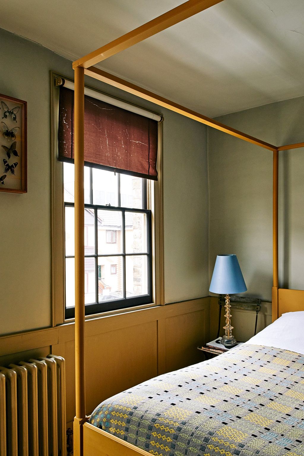 In another bedroom Pedro built this yellow bed which is covered with a vintage Welsh blanket.