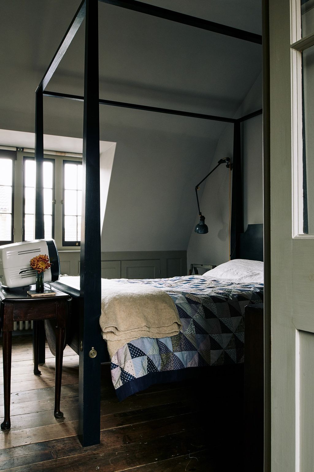 A four poster bed in another bedroom.