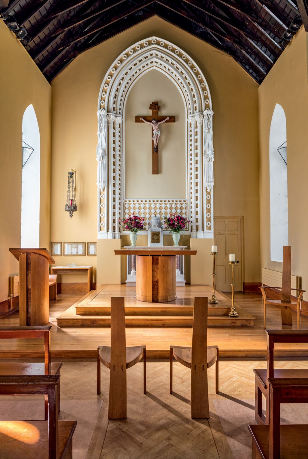 Joseph designed sanctuary furniture for Sacred Heart Church in Minane Bridge nearby .