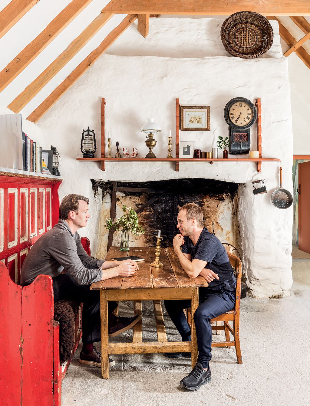 Image may contain Human Person Indoors Living Room Room Interior Design Fireplace Furniture Hearth and Sitting