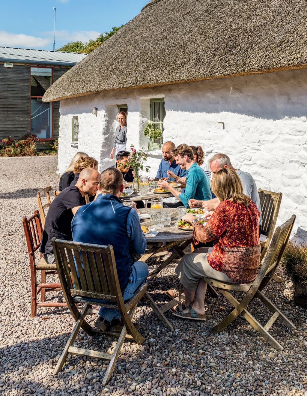 A communal lunch outside with members of the team including Una Crosbie Gabriel Lucille and Jonathan.