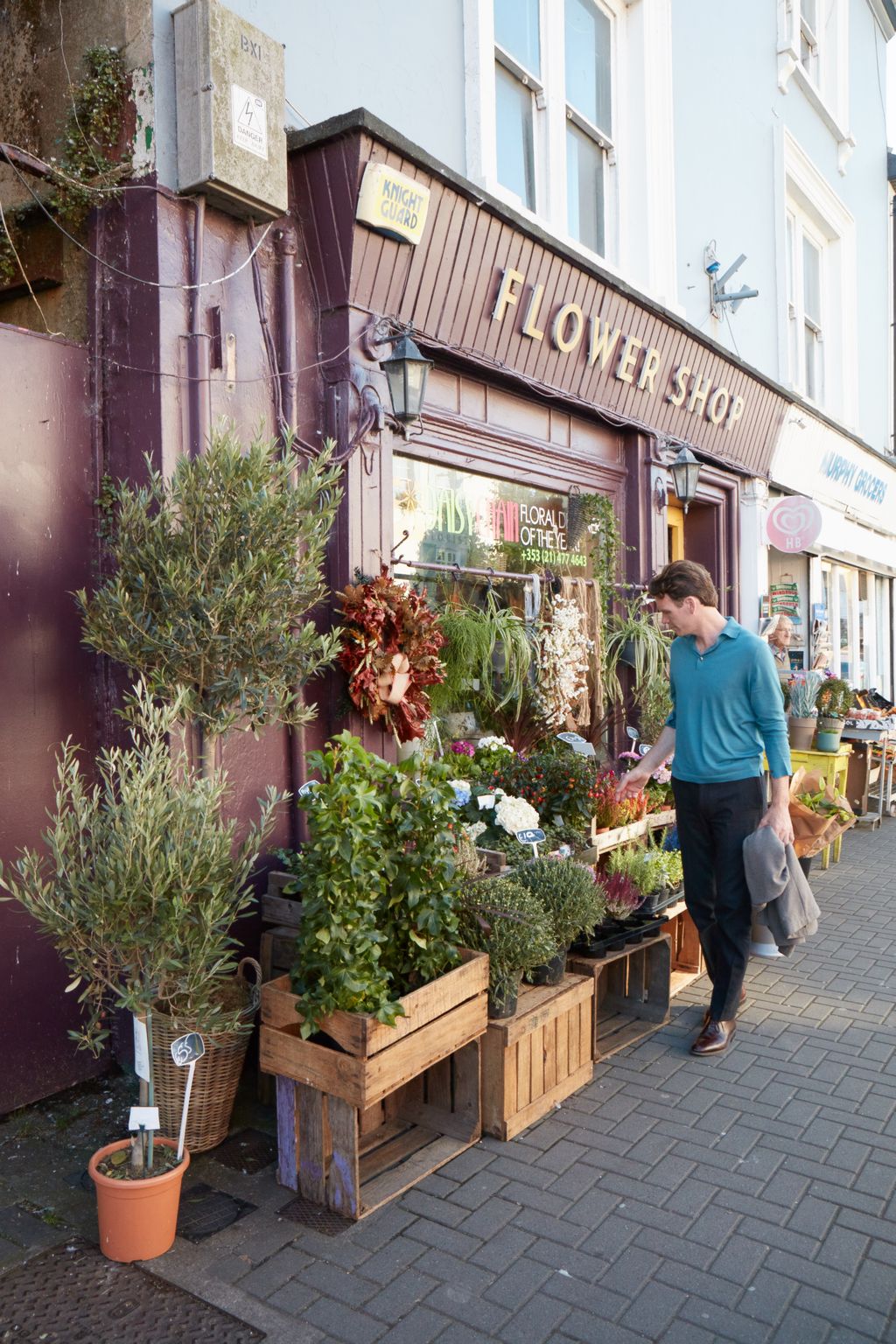 Image may contain Human Person Footwear Clothing Shoe Apparel Market Pedestrian Furniture Bench Shop and Plant