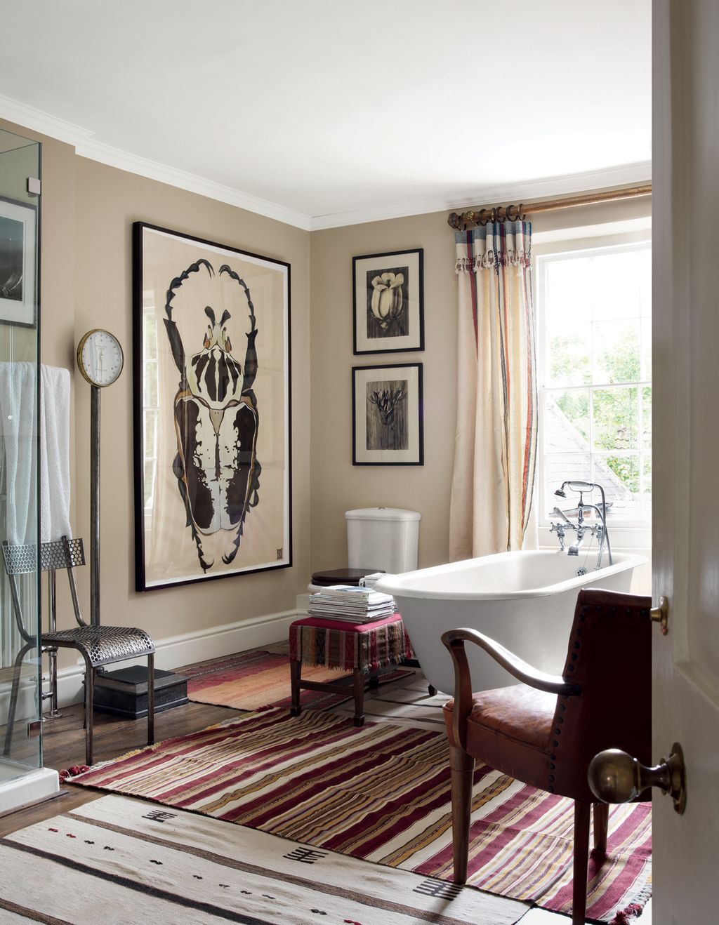 Old camel blankets from Robert Kime were repurposed as curtains here in the main bathroom and in the adjoining bedroom....