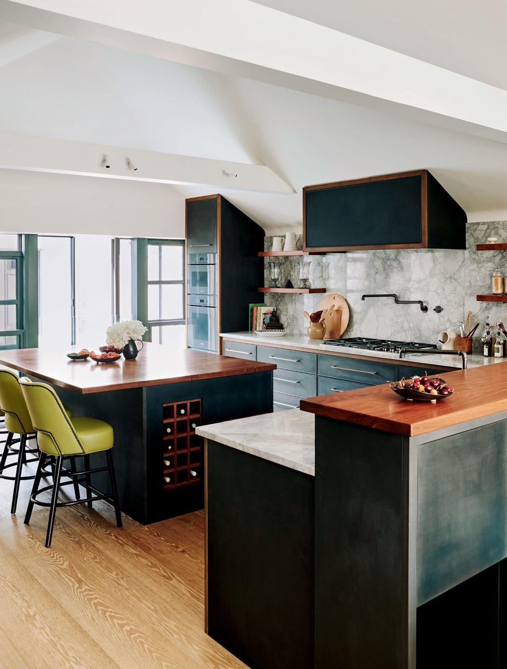 In the original layout the kitchen was tucked away in the basement with no outlook and felt removed from the rest of the...