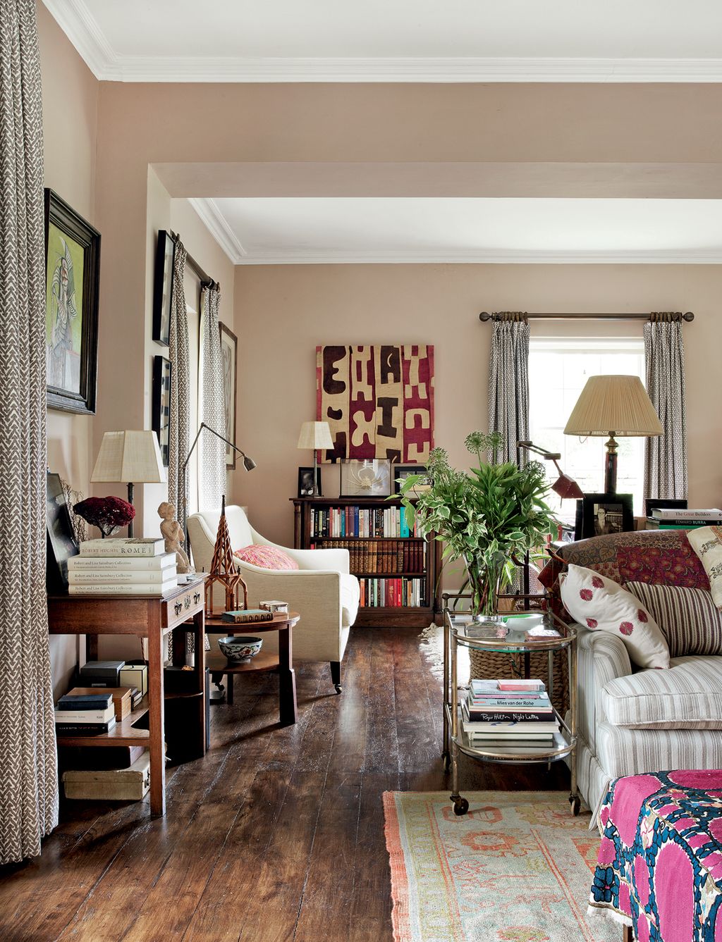 Image may contain Living Room Room Indoors Furniture Couch Interior Design Shelf Bookcase and Flooring