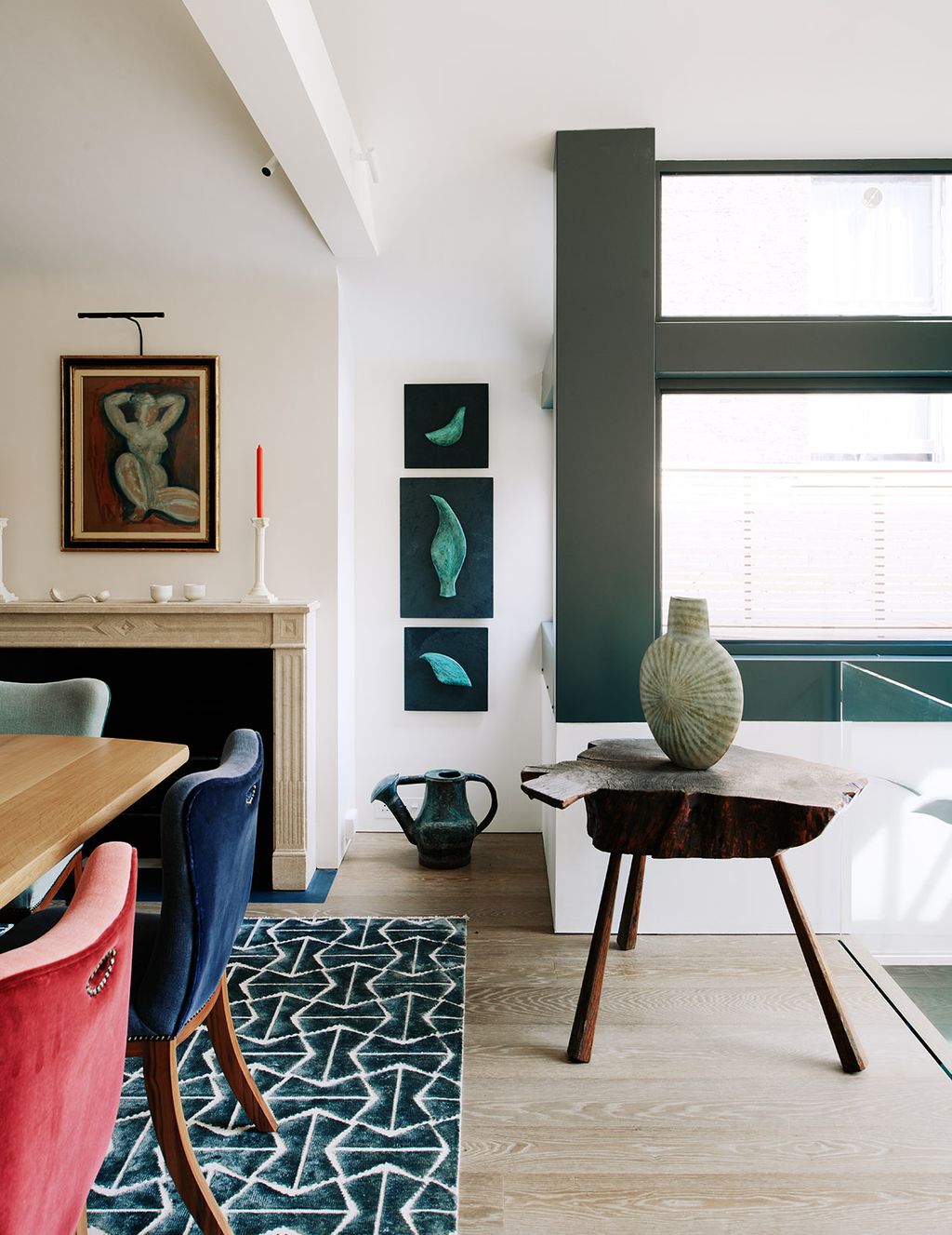 Image may contain Home Decor Indoors Room Furniture Chair Table Interior Design and Living Room