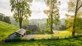 Image may contain Nature Outdoors Countryside Building Rural Grass Plant Housing Grassland Field Hut and Shelter