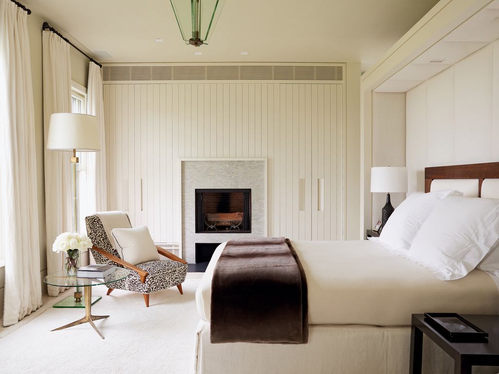 Image may contain Living Room Room Indoors Interior Design Furniture Home Decor Fireplace Cushion Pillow and Couch