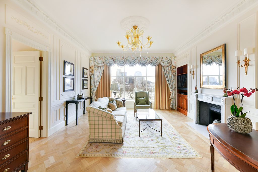 Image may contain Furniture Interior Design Indoors Living Room Room Flooring Floor Home Decor Rug Table and Wood