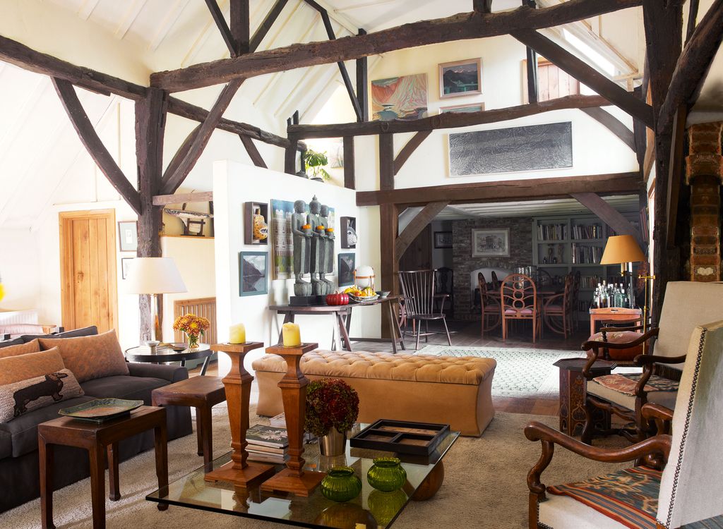 Image may contain Living Room Room Indoors Housing Building Furniture Chair Flooring Loft Lobby Wood and Table