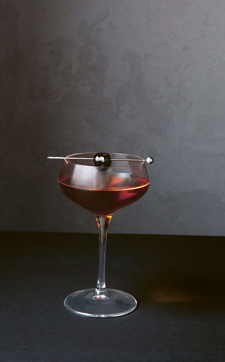 Image may contain Glass Goblet Drink Alcohol Beverage Wine Wine Glass and Lamp