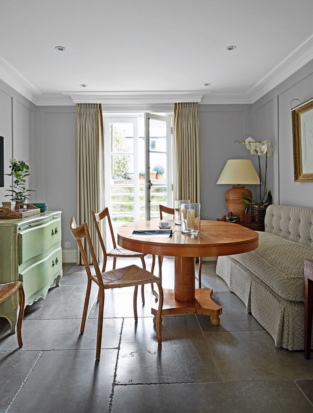 Image may contain Furniture Chair Room Indoors Living Room Flooring Wood Interior Design and Table