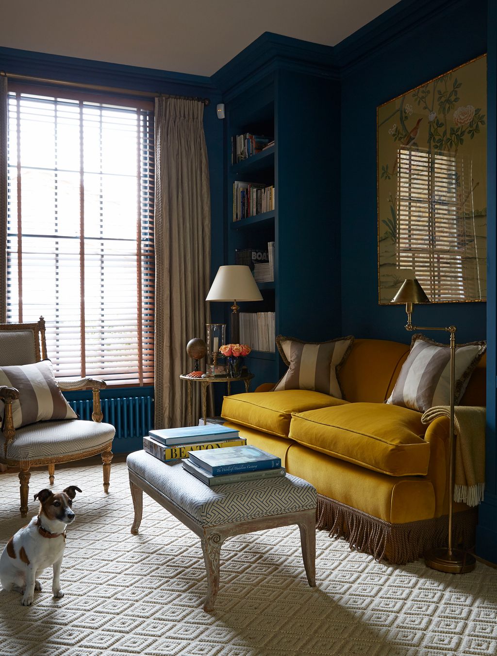 Robert's Jack Russell Lucy is seen in the librarylike rear section of the sitting room where flanking ceilinghigh...