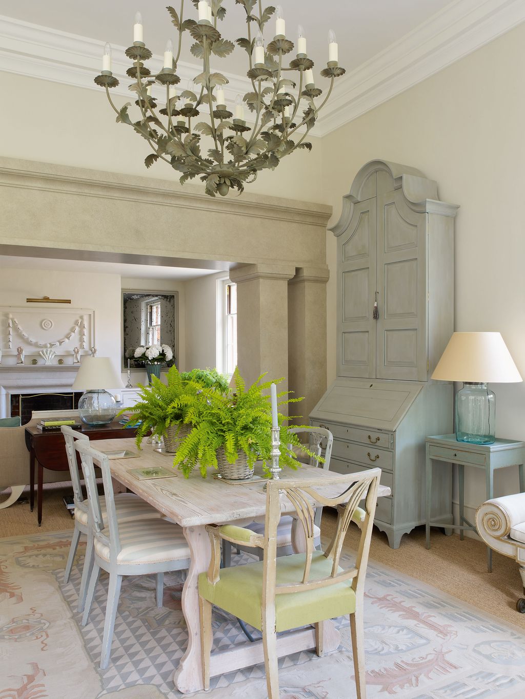 Image may contain Furniture Chair Room Indoors Dining Room Lamp Chandelier Living Room Table Dining Table and Wood