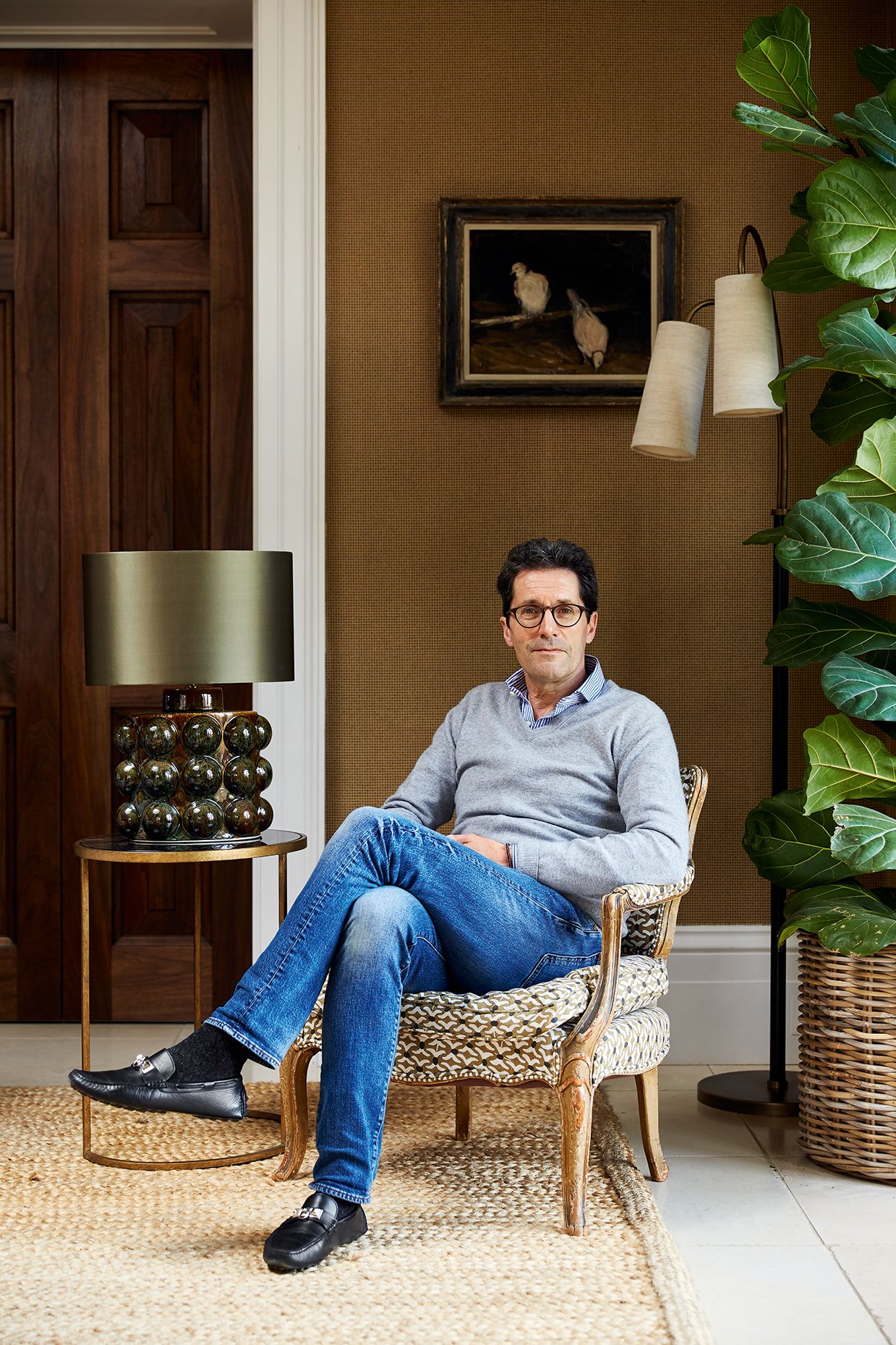 Image may contain Human Person Lamp Table Lamp Plant Furniture and Home Decor