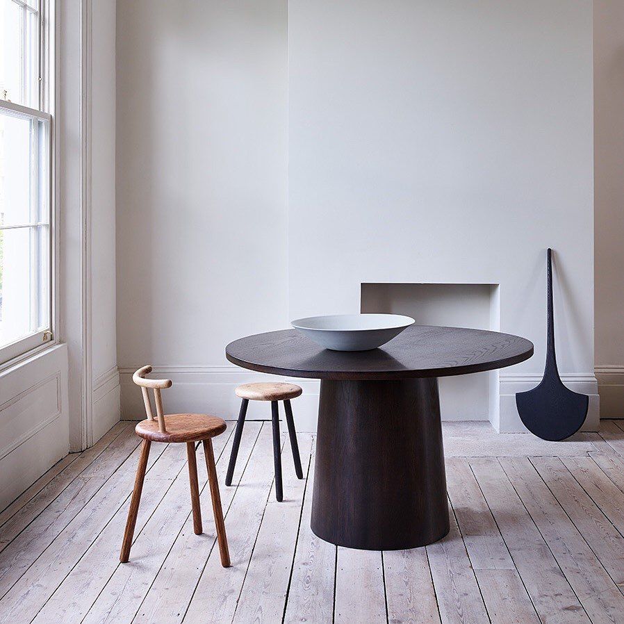 Image may contain Flooring Furniture Floor Table Dining Table Wood and Chair