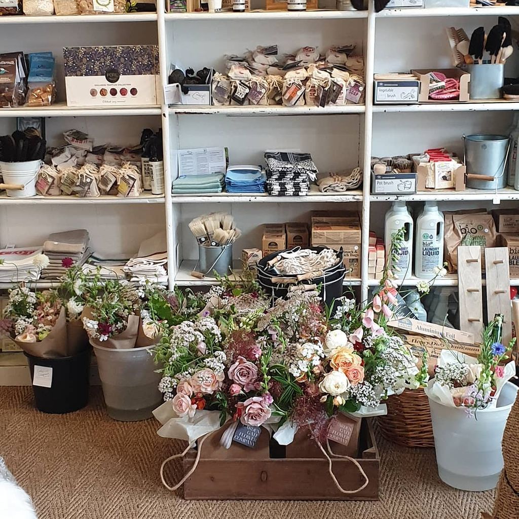 Image may contain Furniture Shelf Plant Flower Blossom Flower Arrangement Indoors and Flower Bouquet