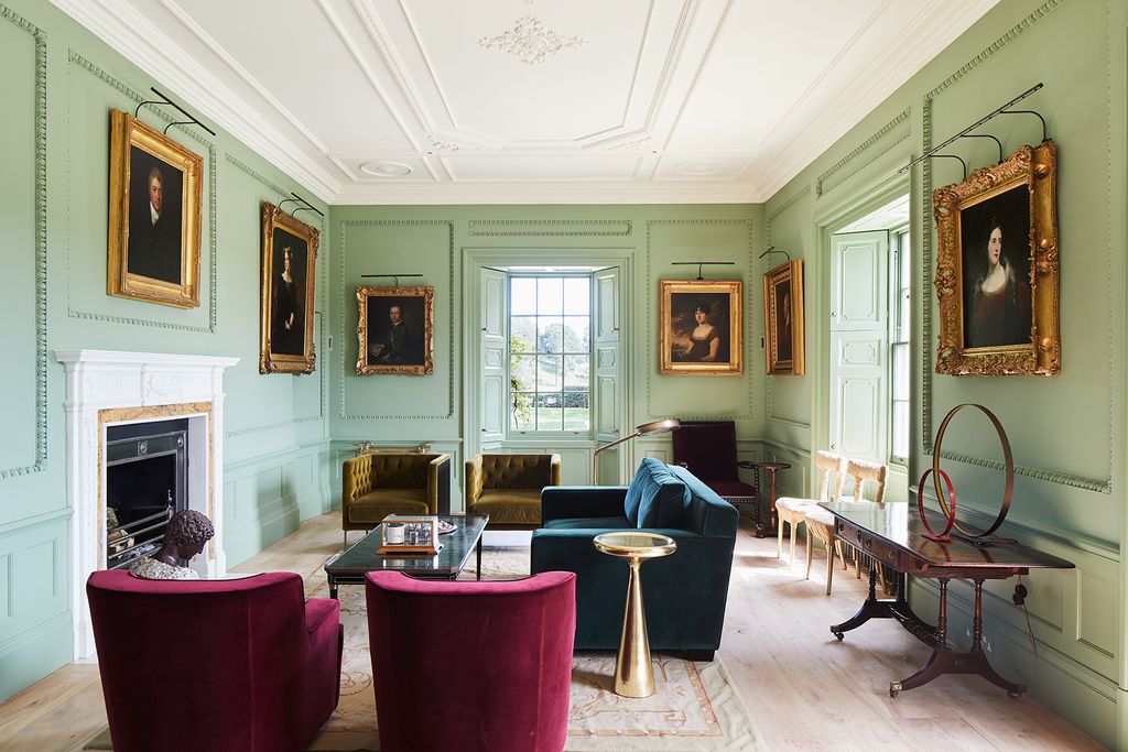 Image may contain Furniture Indoors Room Living Room Chair Lobby Couch Flooring and Waiting Room