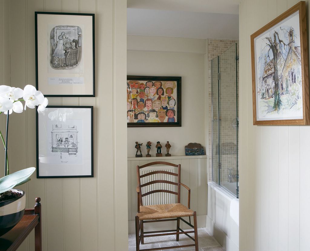 Through the part glazed door is the dressing area and beyond the bathroom.