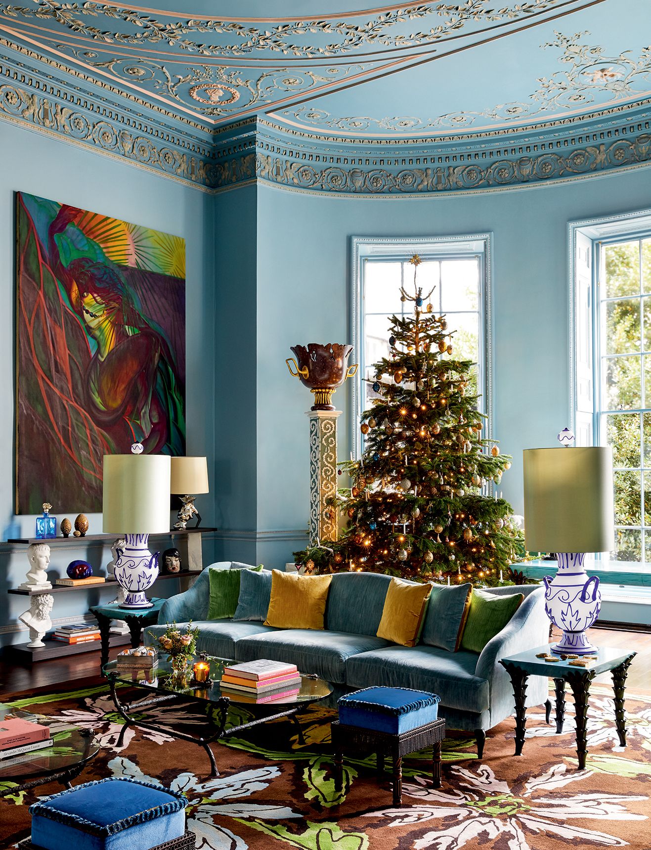 Image may contain Tree Plant Living Room Room Indoors Furniture Couch Table Coffee Table Rug and Interior Design