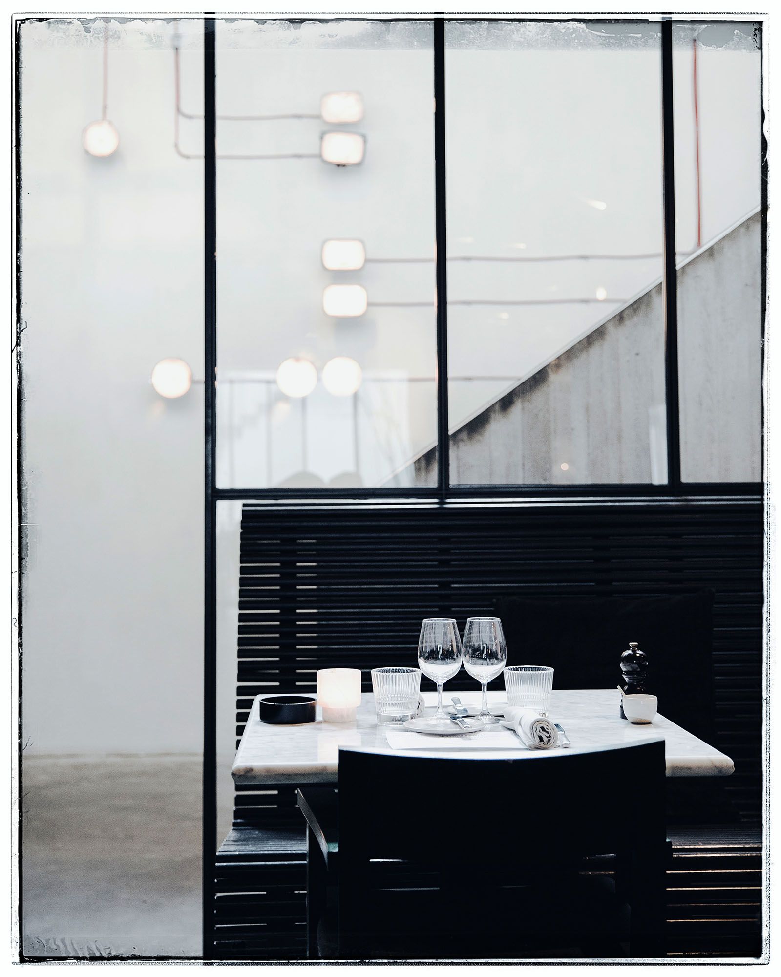 Image may contain Furniture Interior Design Indoors Table Lighting Tabletop Room and Dining Table