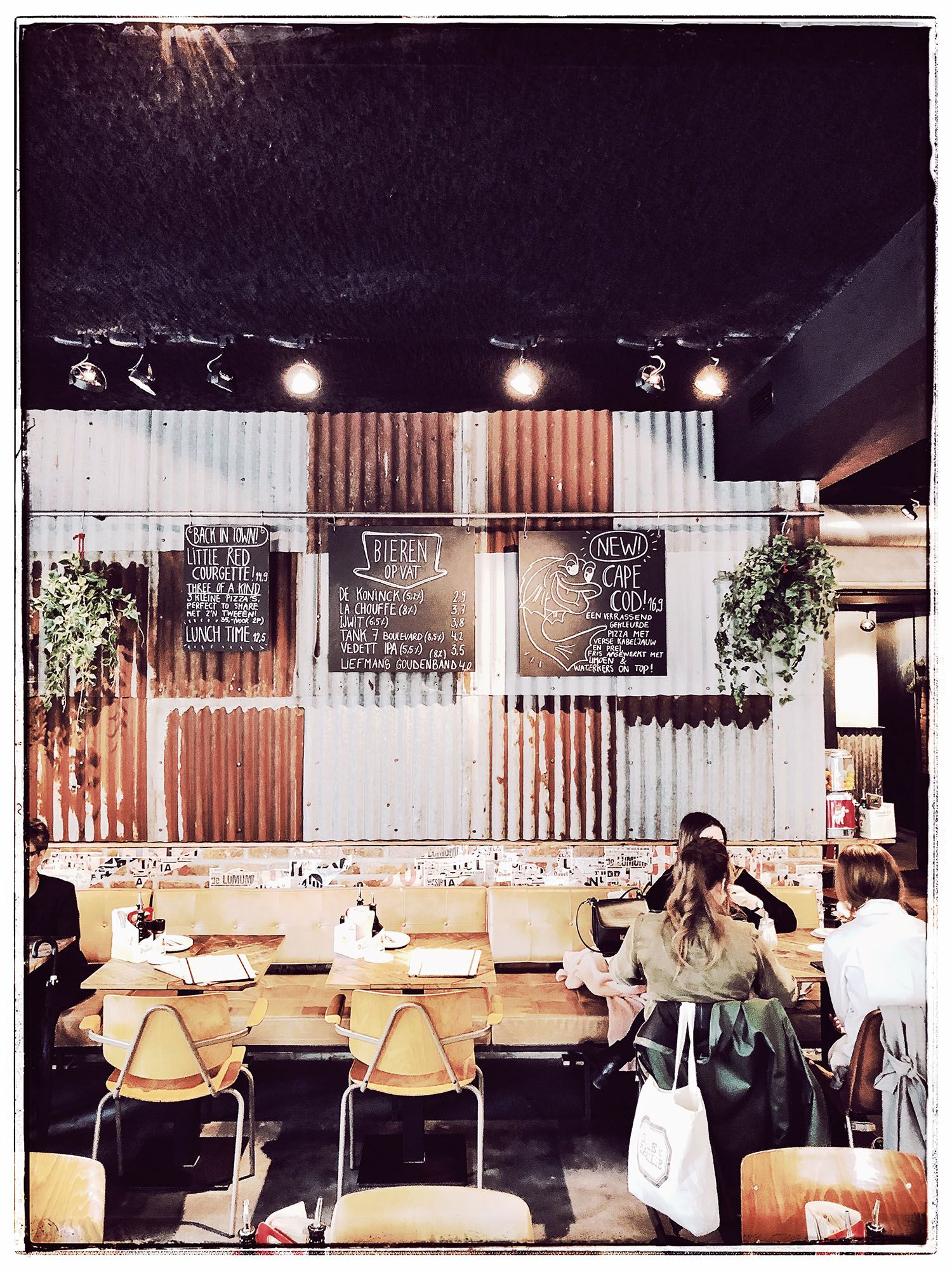 Image may contain Restaurant Human Person Cafe Furniture Chair Cafeteria Food Court and Food