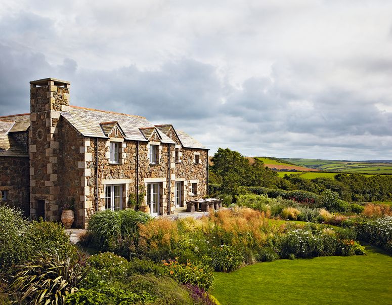 Image may contain: Grass, Plant, Building, Housing, Mansion, House, Architecture, and Cottage