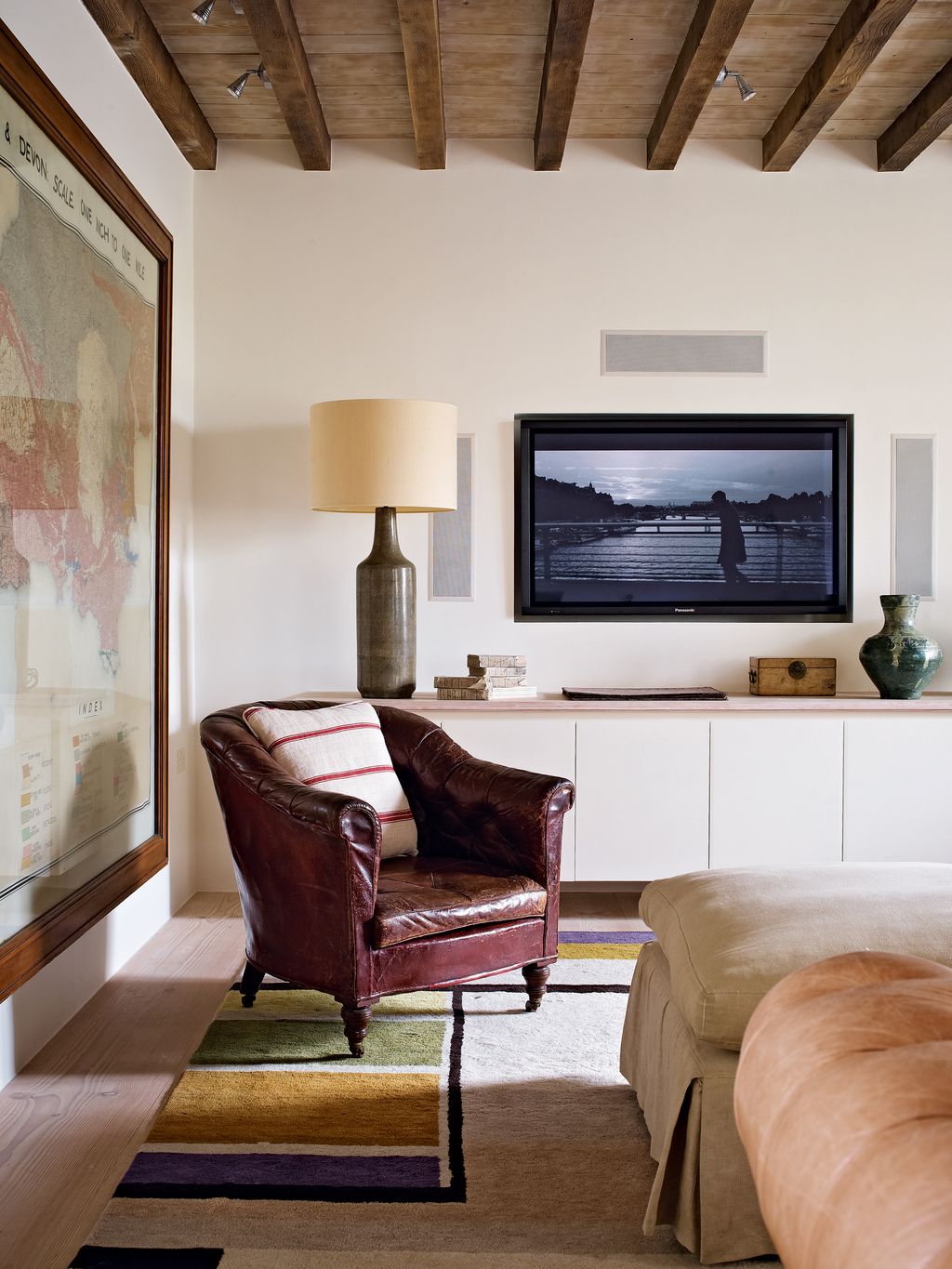 Image may contain Electronics Monitor Display Screen Furniture Living Room Room Indoors Lcd Screen and Couch