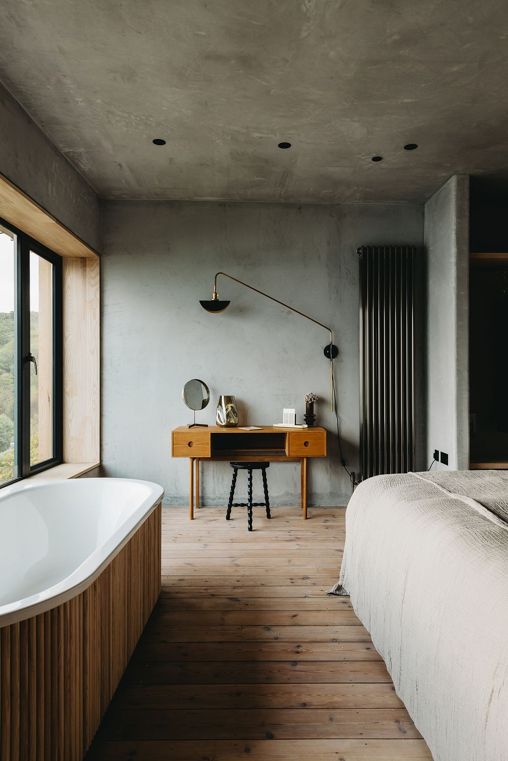 Image may contain Indoors Room Interior Design Flooring Wood Tub Floor Bedroom Housing and Building