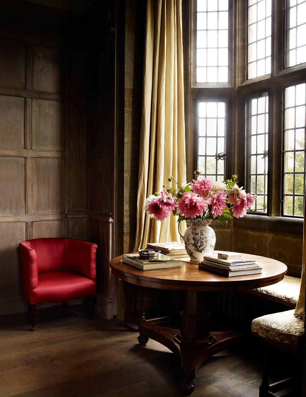 Image may contain Furniture Living Room Room Indoors Table Plant Wood Interior Design Flower and Flower Arrangement