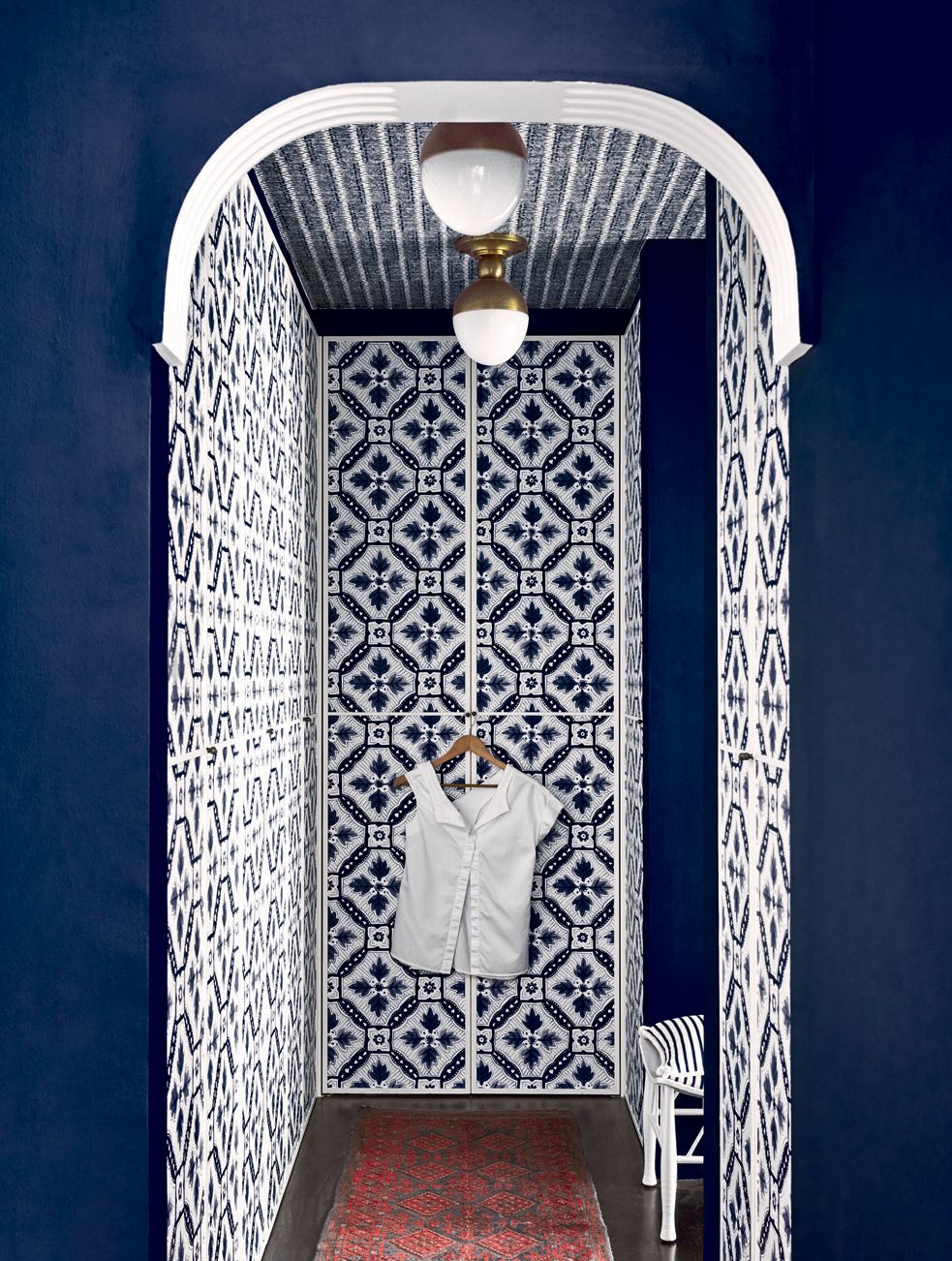 Elizabeth designed the new arched entrance to the dressing room updated the existing wardrobes with a geometric...