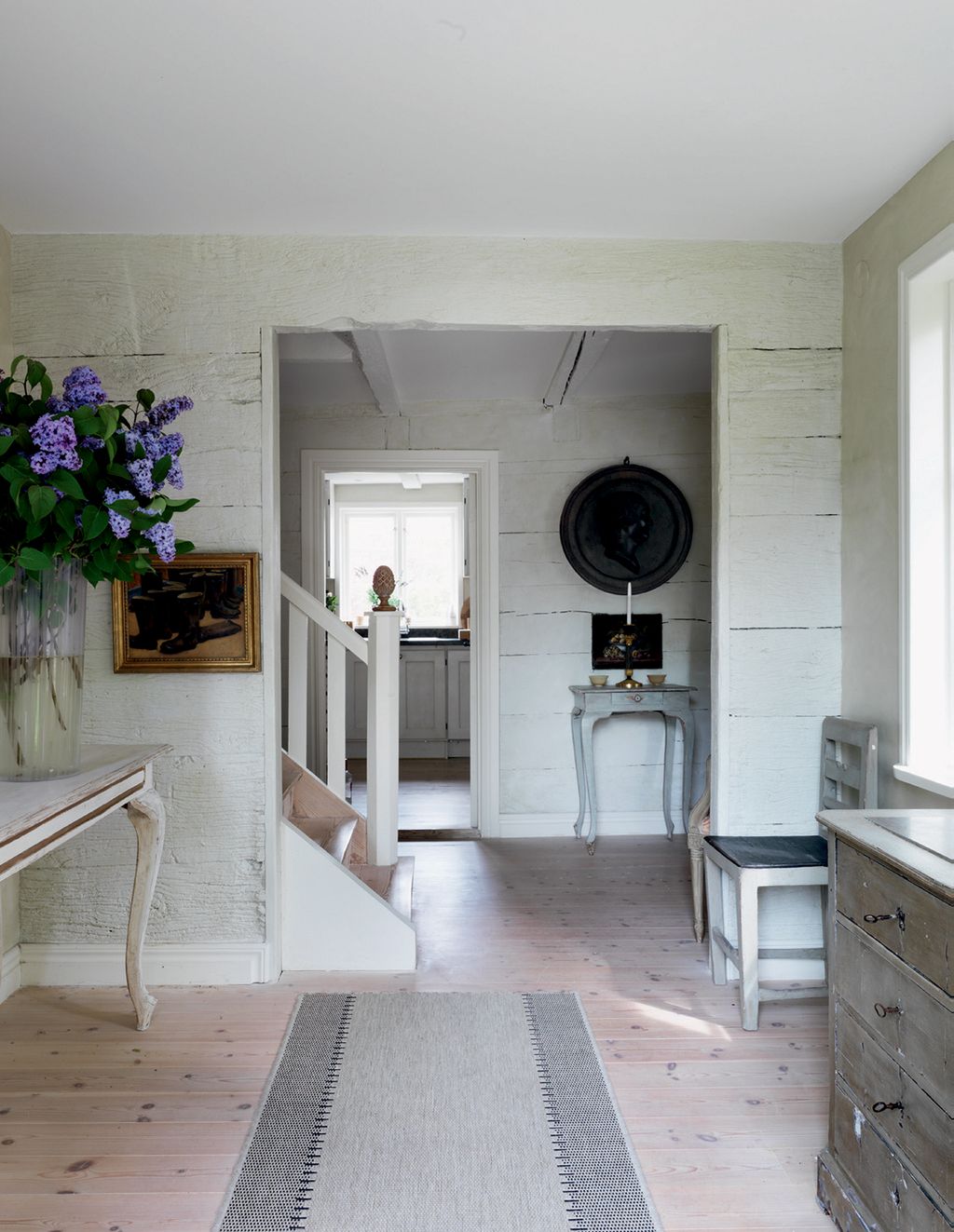 Image may contain Flooring Wood Interior Design Indoors Hardwood Floor Banister Handrail Plant Flower and Blossom