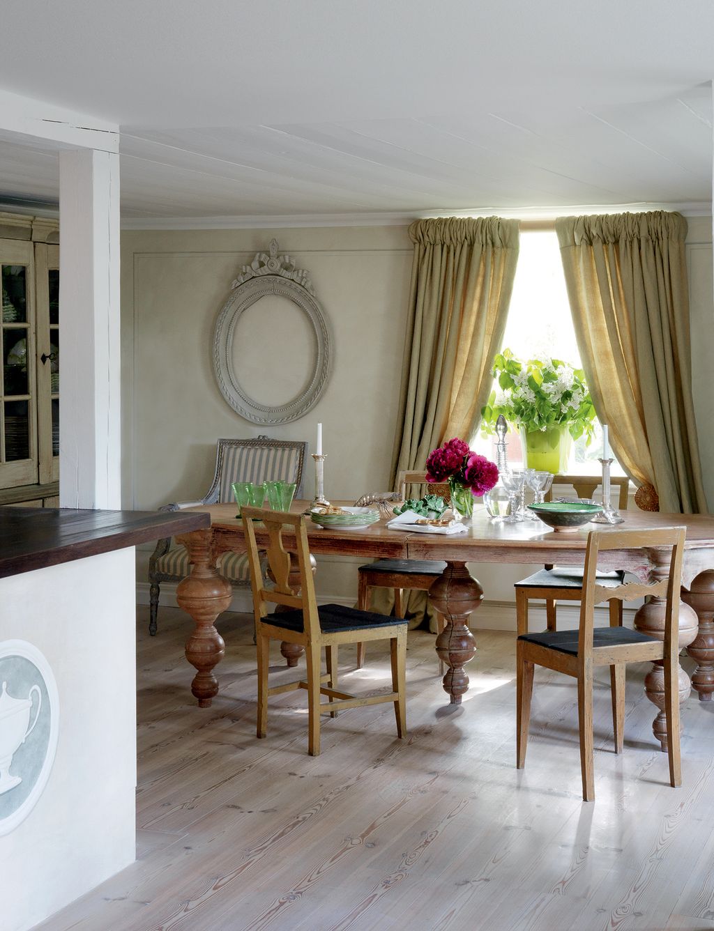 Image may contain Furniture Room Indoors Table Dining Table Chair Flooring Dining Room Wood and Home Decor