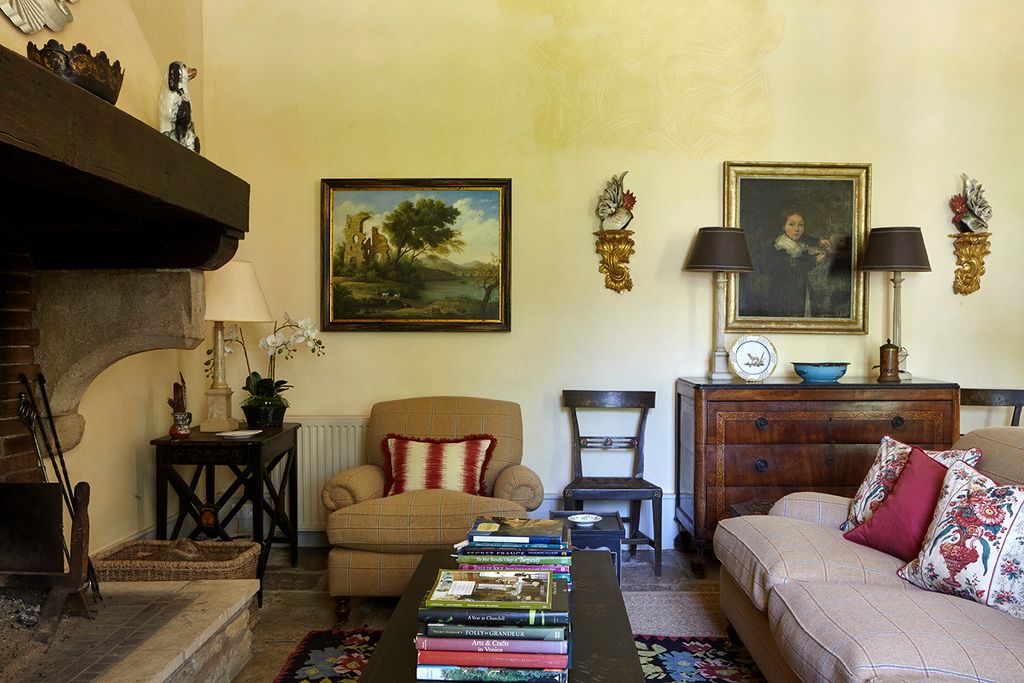 Image may contain Living Room Indoors Room Furniture Couch Interior Design Wood Architecture Clock Tower and Tower