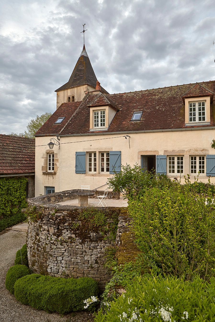 Image may contain Roof Spire Architecture Tower Steeple Building Path Walkway and Flagstone