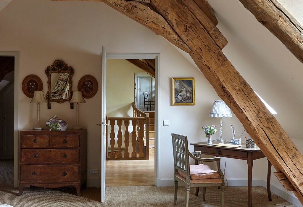 Image may contain Wood Hardwood Flooring Furniture Chair Interior Design Indoors Floor Living Room and Room