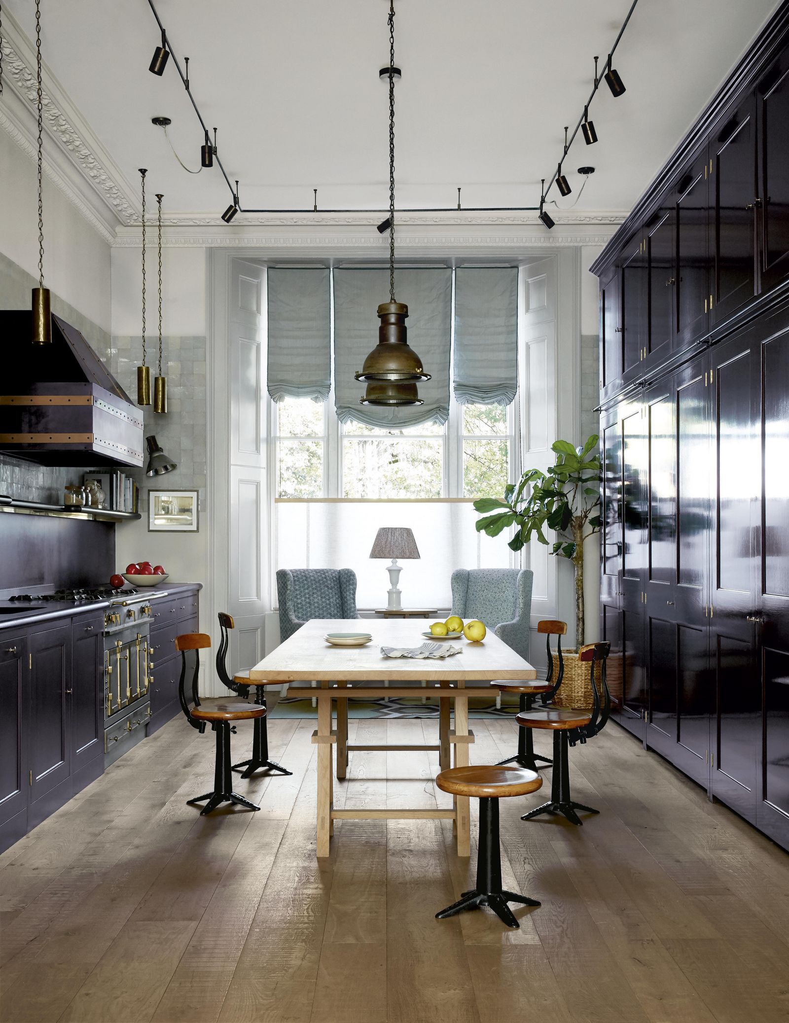 Matthew Cox made the bespoke table which can be lifted or dropped to become an island or dining table depending on what...