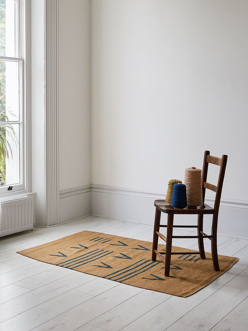 Image may contain Furniture Chair Rug Home Decor Flooring and Floor