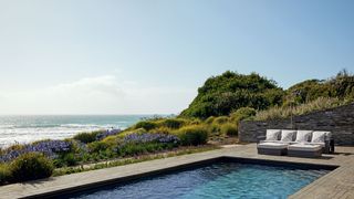 Image may contain Water Pool Outdoors Building Swimming Pool Hotel Nature and Resort